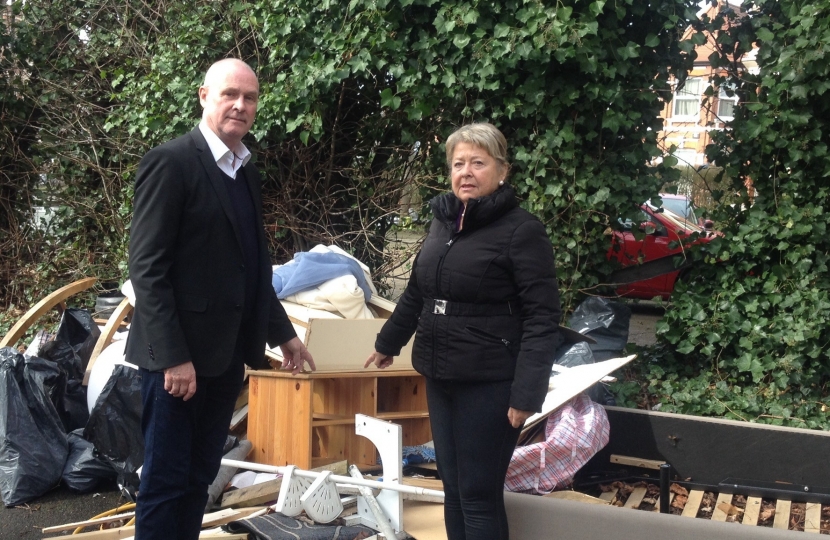 Cllr John Warren and Cllr Carol Shaw inspecting fly tipping in Brondesbury Park