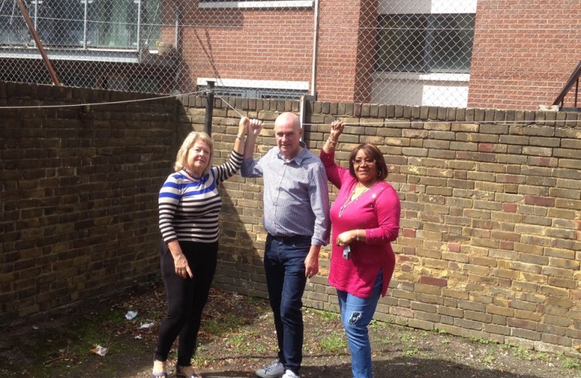 Cllr Carol Shaw, Cllr John Warren and Bertha Joseph inspecting the outside space at Frontenac