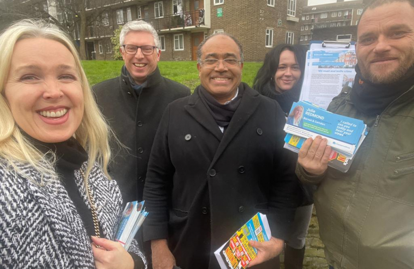 Julie Redmond and Don Williams talking with voters in Kilburn