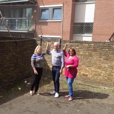 Cllr Carol Shaw, Cllr John Warren and Bertha Joseph inspecting the outside space at Frontenac