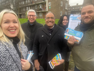 Julie Redmond and Don Williams talking with voters in Kilburn